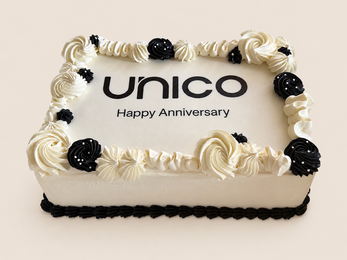 Black and white corporate anniversary logo sheet cake by La Bouchée