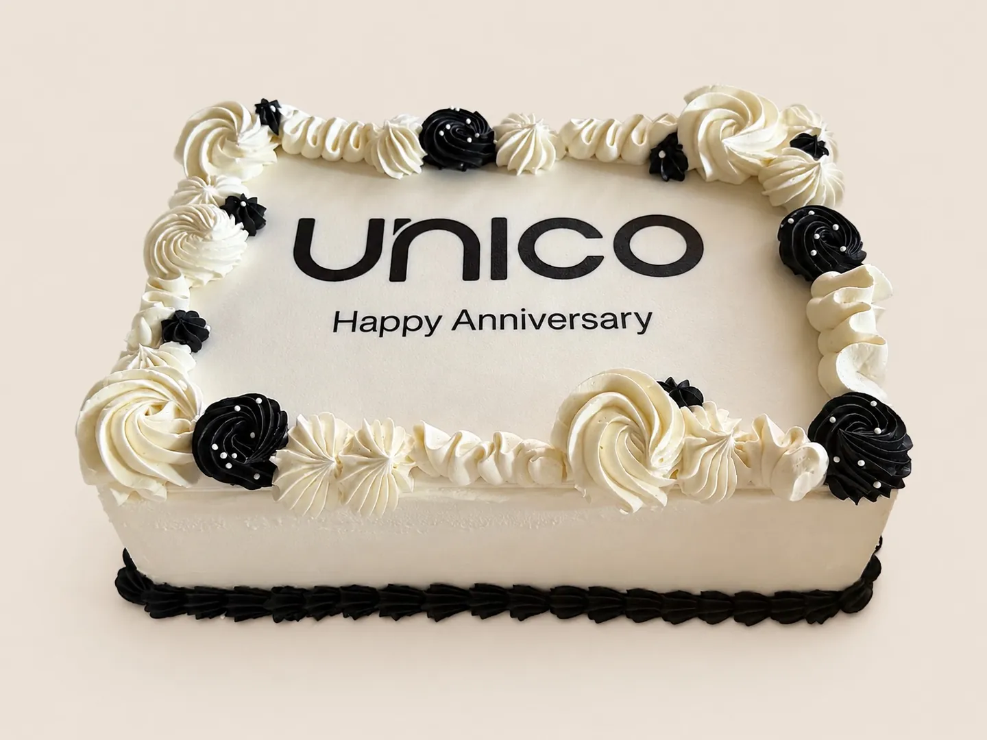 Black and white corporate anniversary logo sheet cake