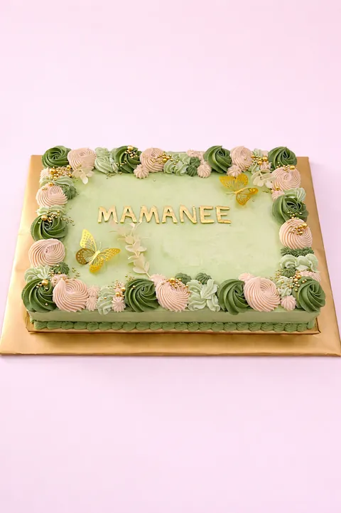 Green buttercream sheet cake with butterflies and custom message