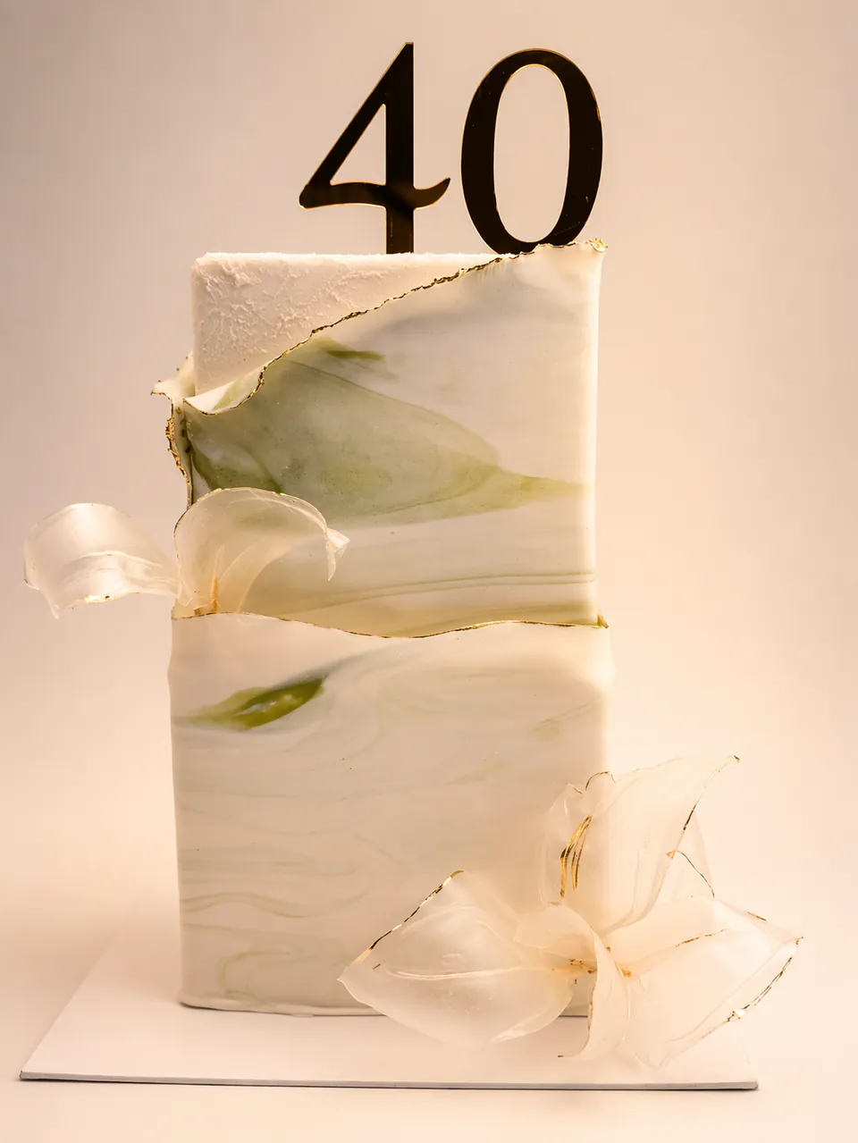Modern tall 40th birthday cake with chocolate sails