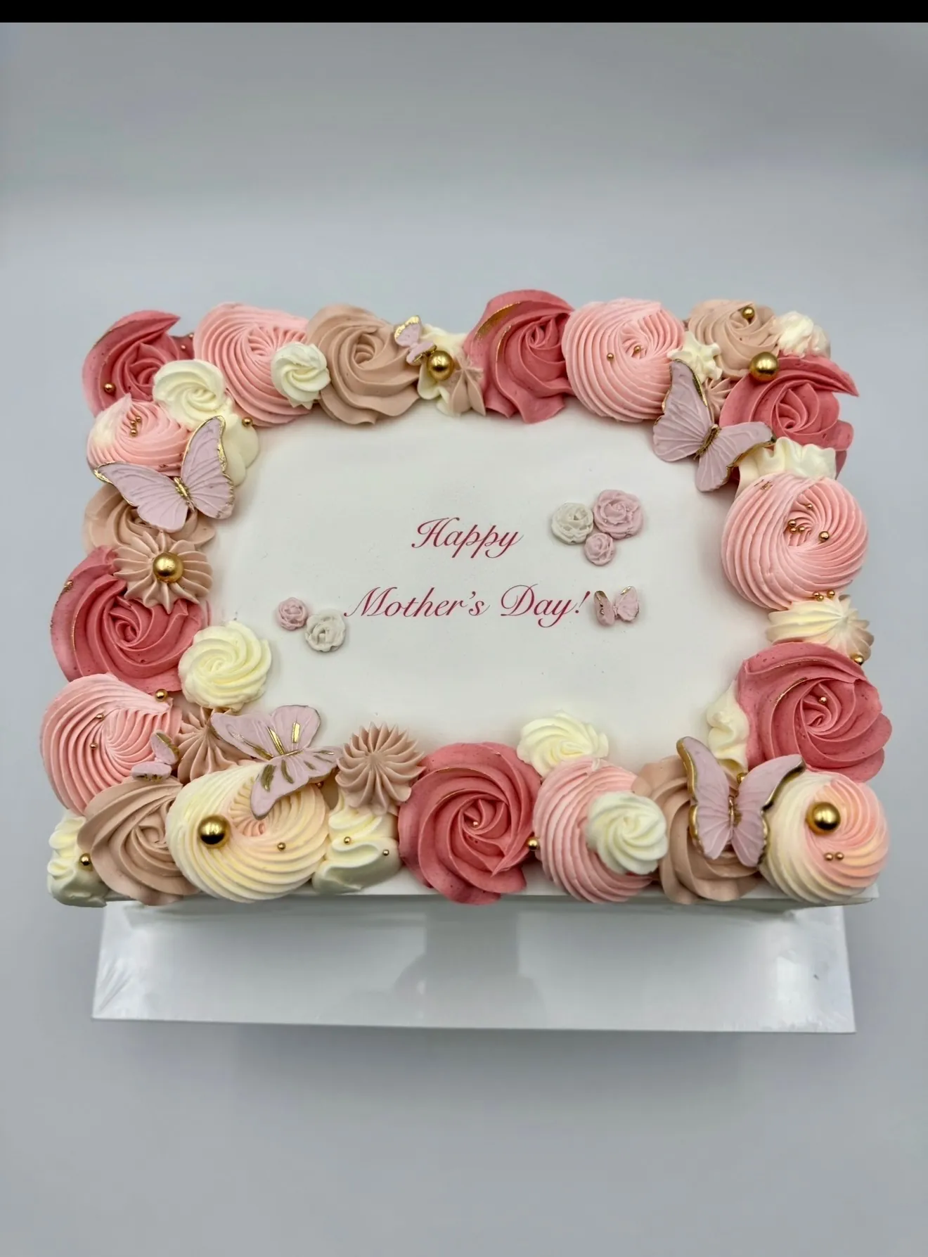 Mother's day buttercream sheet cake with a custom logo design