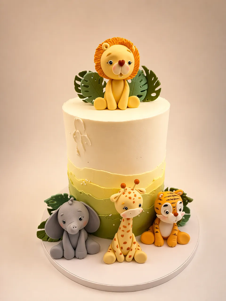 Safari animal birthday cake with lion, elephant, giraffe, and tiger