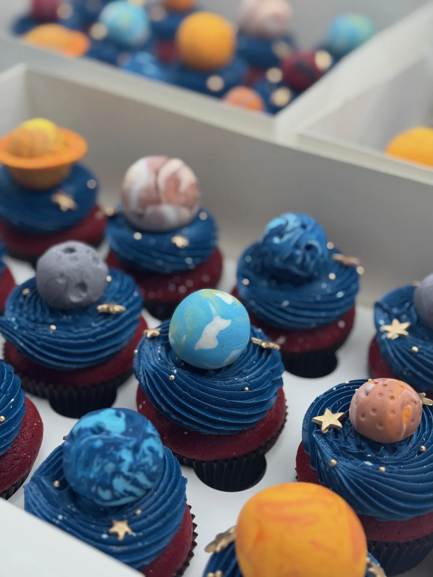 Red velvet cupcake with space theme decorations