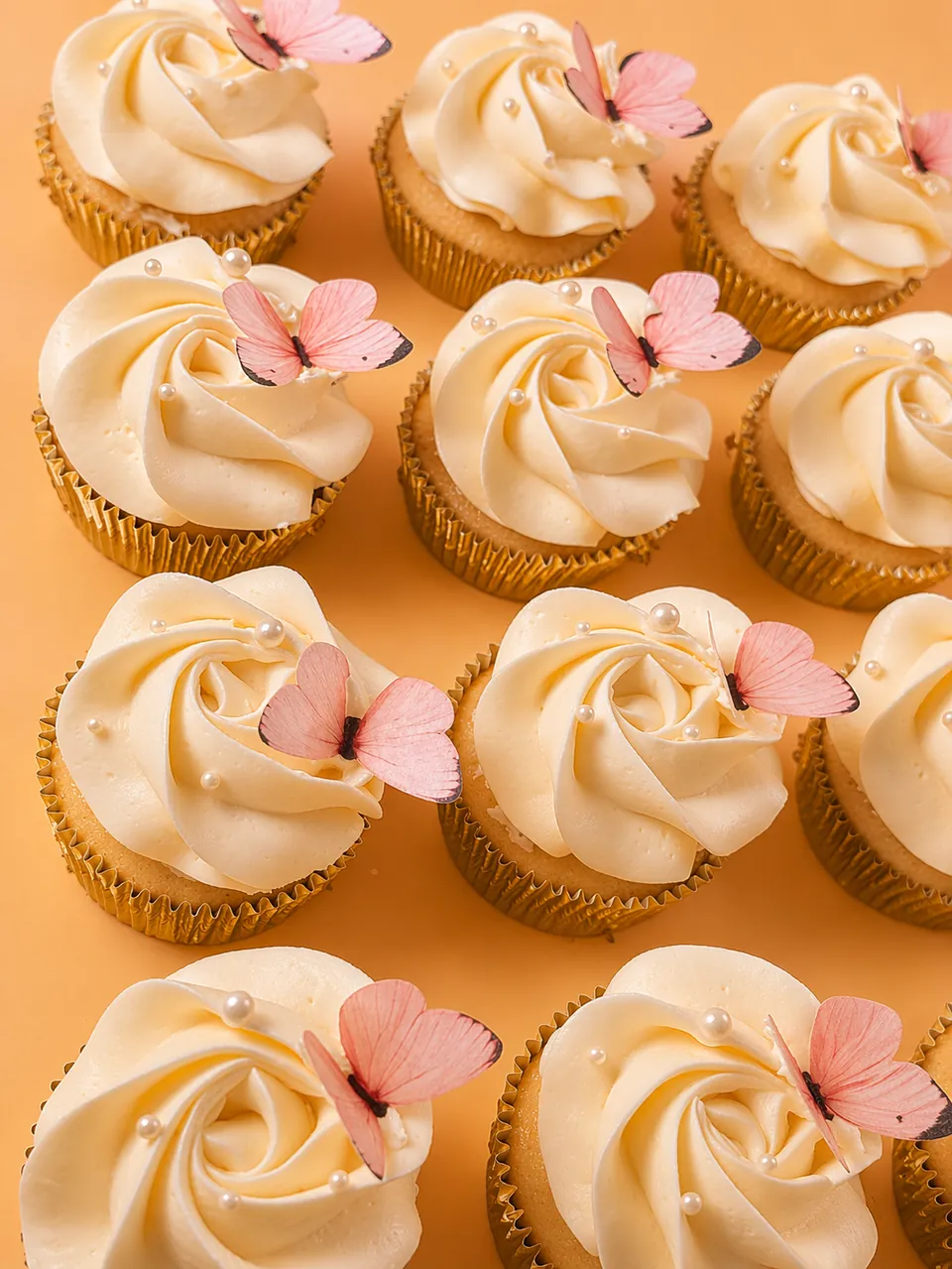 Vanilla cupcake with butterfly decorations
