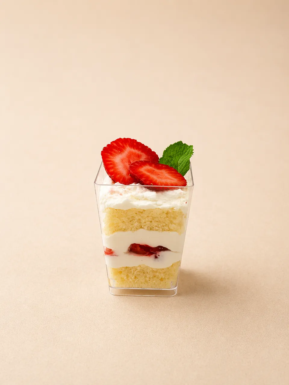Vanilla strawberry Sweet Shot with soft cake, cream, and fresh strawberries